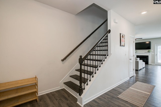 121 Bridgeport Rd, Elgin, SC 29045 - stairway with wood finished floors, baseboards, and a fireplace
