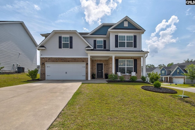 121 Bridgeport Rd, Elgin, SC 29045 - view of front of house featuring brick siding, covered porch, driveway, an attached garage, and a front lawn