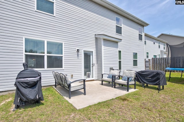 121 Bridgeport Rd, Elgin, SC 29045 - rear view of house with a trampoline and a patio