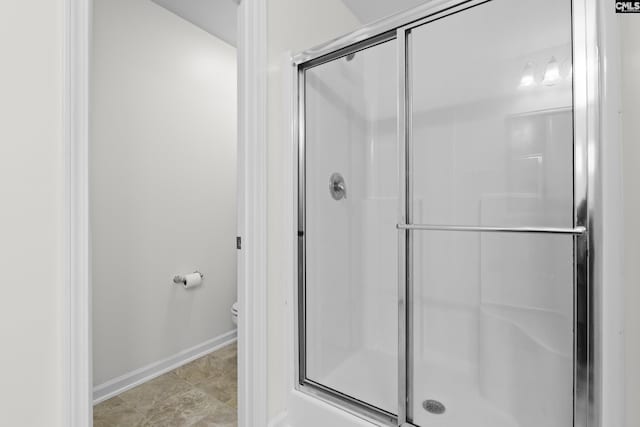 150 Ventnor Ave, Chapin, SC 29036 - full bathroom featuring a stall shower, baseboards, and toilet