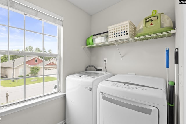150 Ventnor Ave, Chapin, SC 29036 - laundry area with healthy amount of natural light and washing machine and dryer