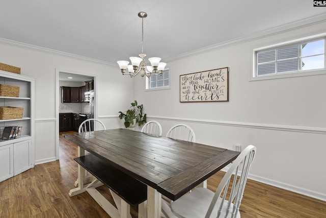 150 Ventnor Ave, Chapin, SC 29036 - dining room featuring crown molding, plenty of natural light, a chandelier, dark wood-type flooring, and baseboards