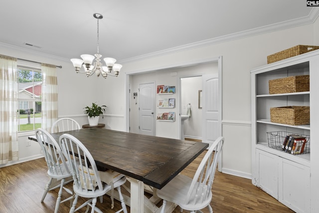 150 Ventnor Ave, Chapin, SC 29036 - dining room featuring a chandelier, ornamental molding, and wood finished floors