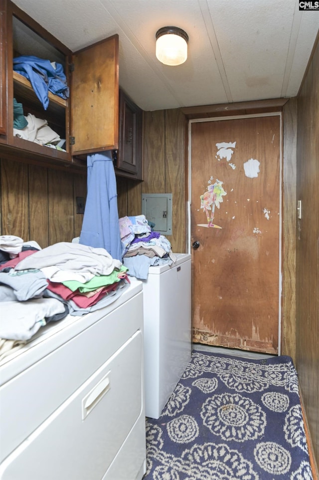 3334 Spring Dr, West Columbia, SC 29170 - laundry area featuring cabinet space, washing machine and dryer, electric panel, and wooden walls