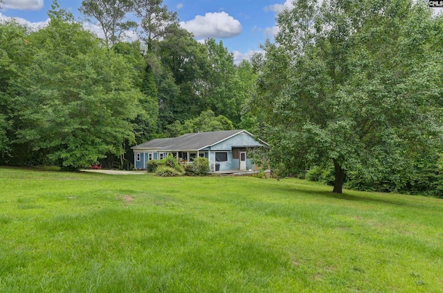3334 Spring Dr, West Columbia, SC 29170 - ranch-style house featuring a front yard and a wooded view