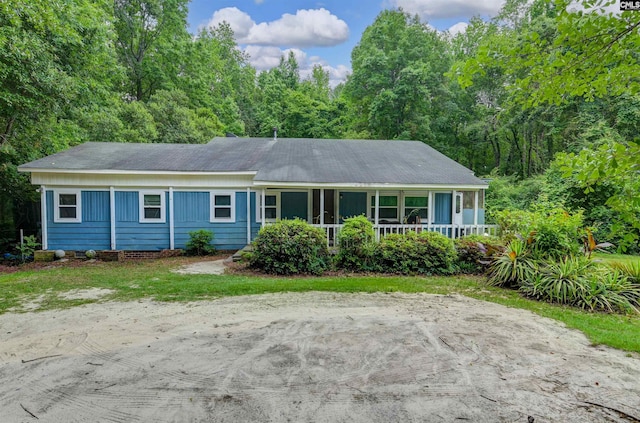 3334 Spring Dr, West Columbia, SC 29170 - ranch-style house featuring a porch and a view of trees