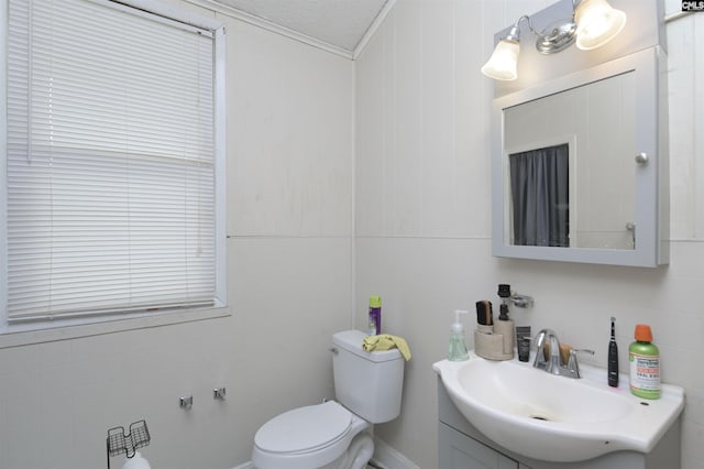 3334 Spring Dr, West Columbia, SC 29170 - bathroom with toilet, vanity, crown molding, and tile walls