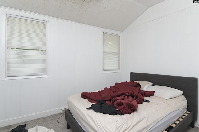 3334 Spring Dr, West Columbia, SC 29170 - carpeted bedroom featuring vaulted ceiling, baseboards, and a textured ceiling