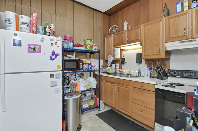 3334 Spring Dr, West Columbia, SC 29170 - kitchen with freestanding refrigerator, electric stove, under cabinet range hood, light countertops, and wood walls