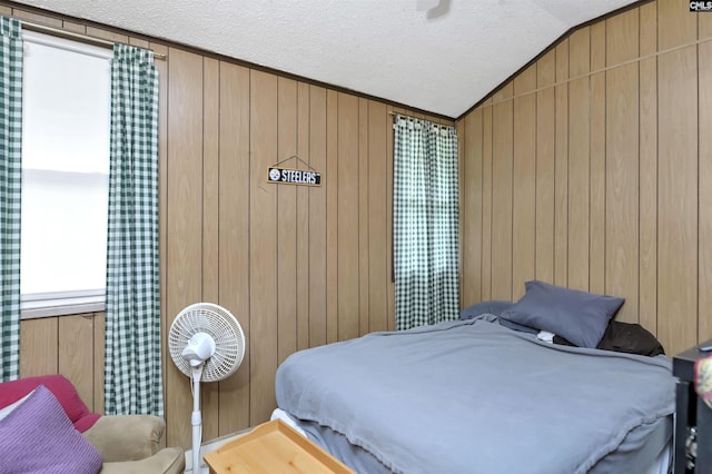 3334 Spring Dr, West Columbia, SC 29170 - bedroom with vaulted ceiling, a textured ceiling, and wooden walls