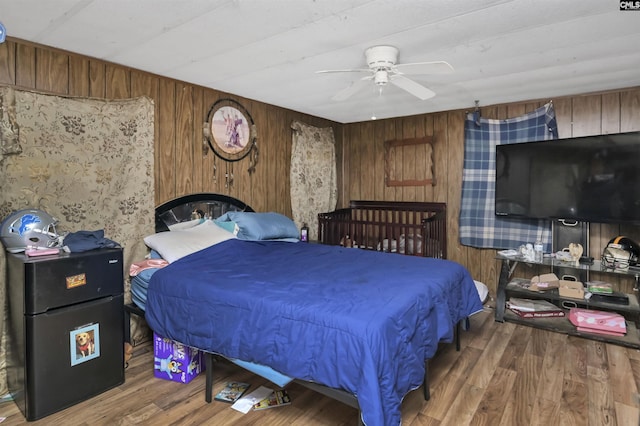 3334 Spring Dr, West Columbia, SC 29170 - bedroom featuring wood finished floors, wood walls, and ceiling fan