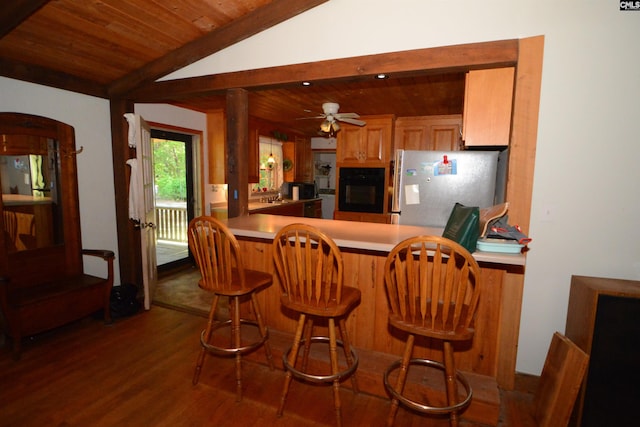 141 Frost Rd, Camden, SC 29020 - kitchen with oven, freestanding refrigerator, wood finished floors, wooden ceiling, and vaulted ceiling