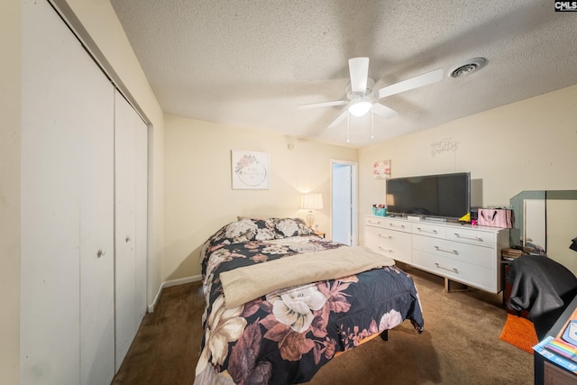 1211 Metze Rd Unit E6, Columbia, SC 29210 - bedroom with dark colored carpet, a closet, a textured ceiling, and a ceiling fan