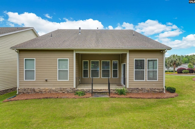 1 Downing Cir, Gilbert, SC 29054 - back of property with a lawn, covered porch, and roof with shingles