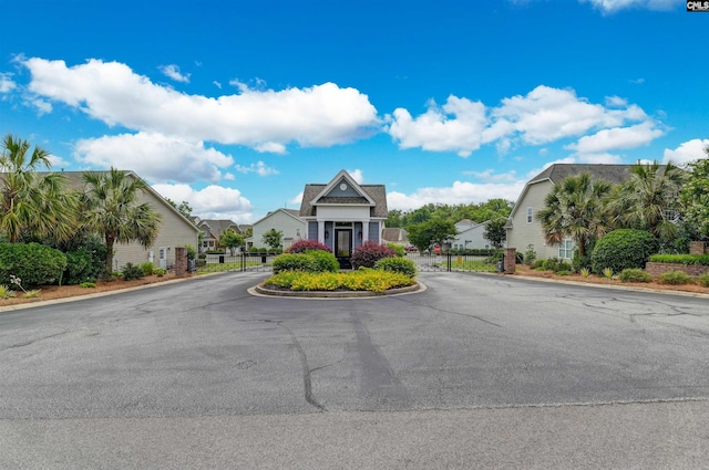 1 Downing Cir, Gilbert, SC 29054 - view of asphalt road featuring a gated entry, curbs, and a gate