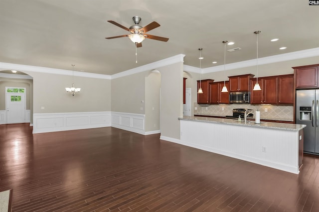 1 Downing Cir, Gilbert, SC 29054 - kitchen featuring stainless steel appliances, arched walkways, ceiling fan, ornamental molding, and light stone counters