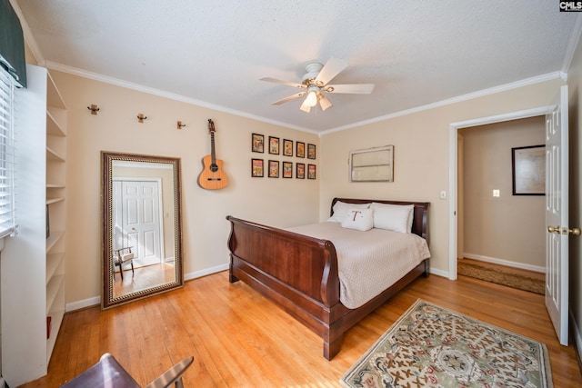 3100 Grace Hill Rd, Columbia, SC 29204 - bedroom with light wood-type flooring, ornamental molding, baseboards, a ceiling fan, and a textured ceiling