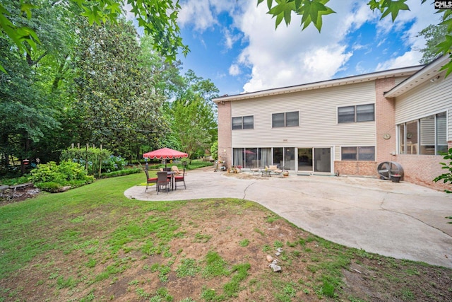 3100 Grace Hill Rd, Columbia, SC 29204 - rear view of house with a patio area, a lawn, and brick siding