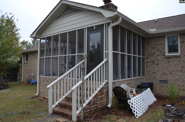 429 Kitti Wake Dr, West Columbia, SC 29170 - view of side of home featuring a sunroom, a chimney, brick siding, a yard, and crawl space