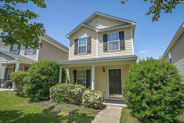 513 Scarlet Sage Ln, Columbia, SC 29223 - traditional home featuring covered porch and a front yard