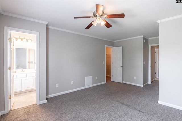 513 Scarlet Sage Ln, Columbia, SC 29223 - unfurnished bedroom with carpet floors, ornamental molding, baseboards, connected bathroom, and a spacious closet