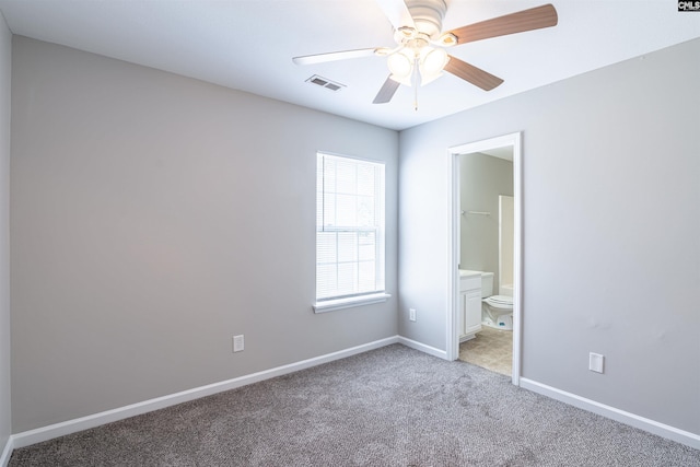 513 Scarlet Sage Ln, Columbia, SC 29223 - unfurnished bedroom featuring light carpet, baseboards, connected bathroom, and ceiling fan