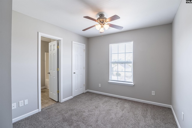 513 Scarlet Sage Ln, Columbia, SC 29223 - unfurnished bedroom featuring carpet, baseboards, connected bathroom, and ceiling fan
