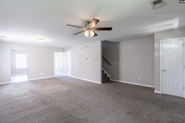 513 Scarlet Sage Ln, Columbia, SC 29223 - unfurnished room featuring a ceiling fan, stairway, dark carpet, and baseboards