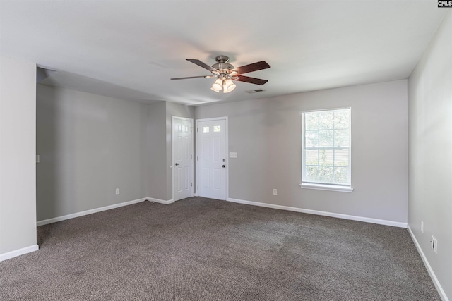 513 Scarlet Sage Ln, Columbia, SC 29223 - spare room featuring dark colored carpet, ceiling fan, and baseboards