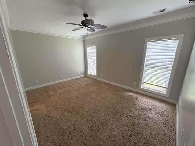 26 Peyton Rd, Columbia, SC 29209 - spare room featuring crown molding, light carpet, a ceiling fan, and baseboards