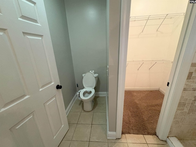26 Peyton Rd, Columbia, SC 29209 - bathroom with a spacious closet, tile patterned floors, toilet, and baseboards