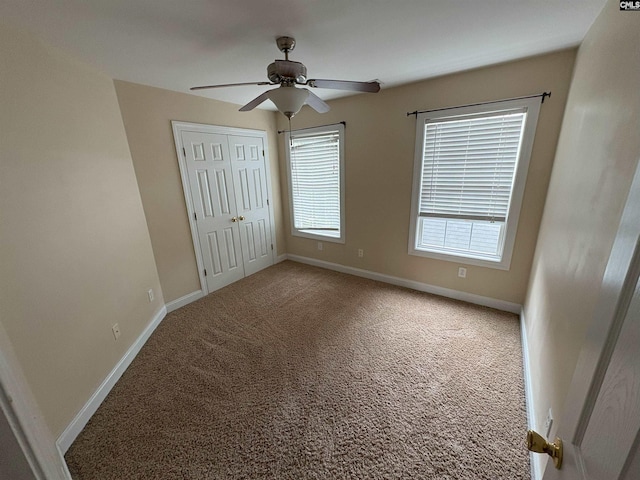 26 Peyton Rd, Columbia, SC 29209 - unfurnished bedroom with multiple windows, carpet flooring, baseboards, and a closet
