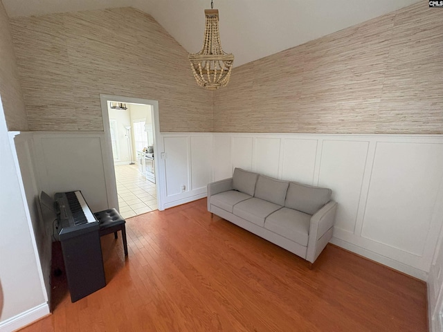 26 Peyton Rd, Columbia, SC 29209 - sitting room featuring a wainscoted wall, vaulted ceiling, a chandelier, and light wood-type flooring