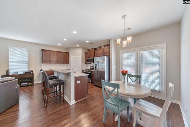 1148 Declaration Dr, Elgin, SC 29045 - dining area featuring a chandelier, recessed lighting, dark wood-style floors, and baseboards