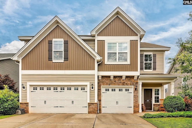 335 Hollow Cove Rd, Chapin, SC 29036 - view of front of home featuring stone siding, concrete driveway, an attached garage, and board and batten siding