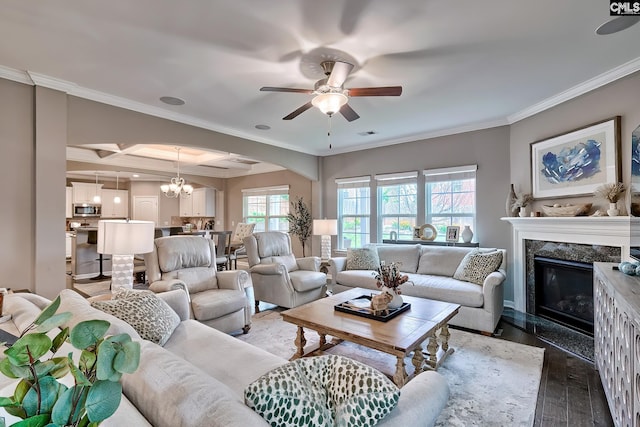 335 Hollow Cove Rd, Chapin, SC 29036 - living room with arched walkways, a high end fireplace, a ceiling fan, light wood finished floors, and a chandelier