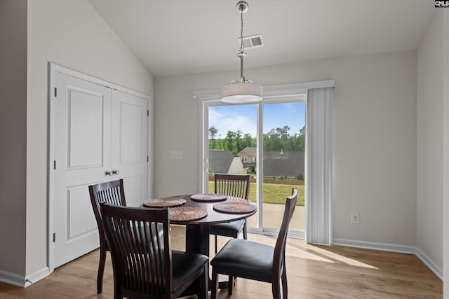 627 Cheehaw Ave, West Columbia, SC 29170 - dining room featuring light wood-style flooring, lofted ceiling, and baseboards