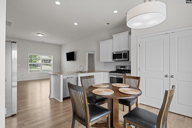 627 Cheehaw Ave, West Columbia, SC 29170 - dining area with light wood-type flooring, recessed lighting, and baseboards