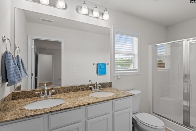627 Cheehaw Ave, West Columbia, SC 29170 - full bath featuring toilet, a shower stall, and double vanity