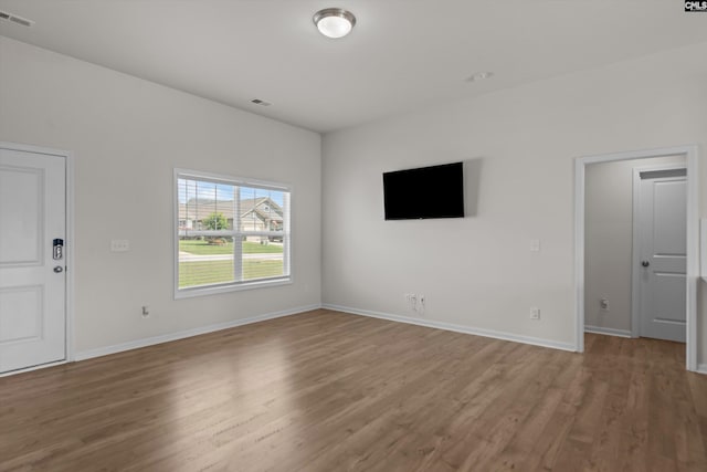 627 Cheehaw Ave, West Columbia, SC 29170 - unfurnished living room featuring wood finished floors and baseboards