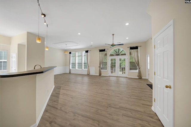 23 Ash Ct, Irmo, SC 29063 - unfurnished living room featuring light wood-type flooring, ceiling fan, recessed lighting, baseboards, and french doors