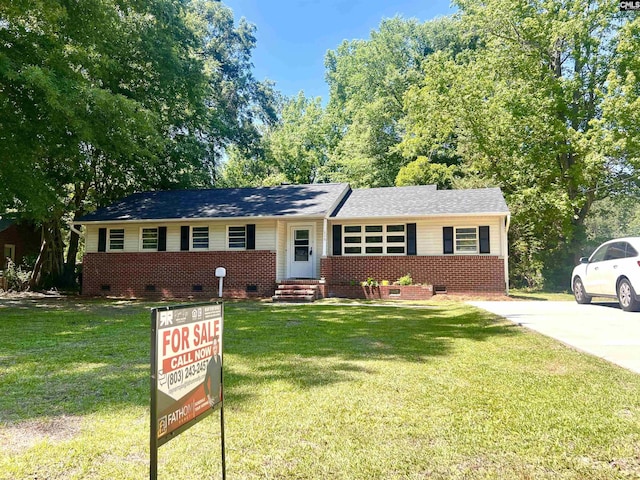 609 E Charlotte Ave, Sumter, SC 29150 - single story home featuring crawl space, a front lawn, entry steps, brick siding, and a shingled roof