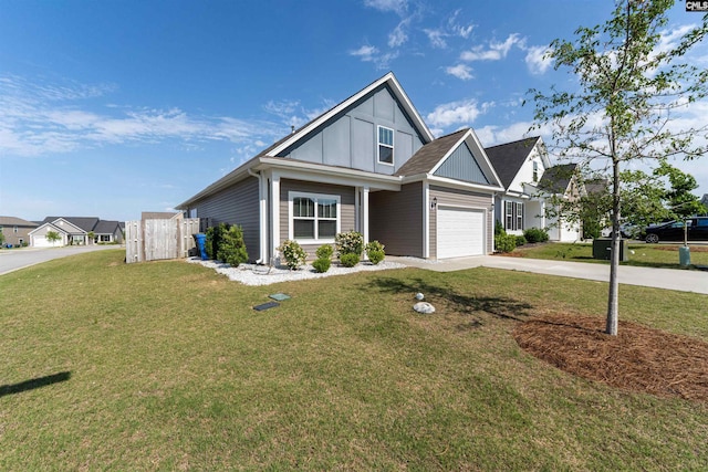 1401 Ardennes Dr, Elgin, SC 29045 - view of front of home with driveway, board and batten siding, and a front lawn