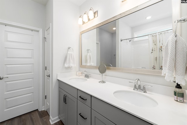 1401 Ardennes Dr, Elgin, SC 29045 - full bath featuring wood finished floors, double vanity, and a shower with shower curtain