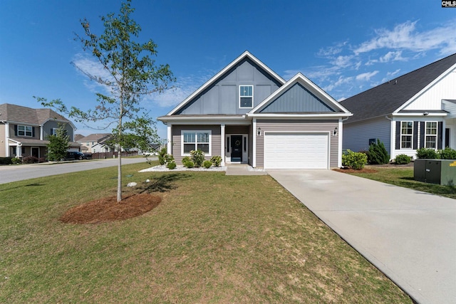 1401 Ardennes Dr, Elgin, SC 29045 - view of front of home featuring board and batten siding, a front yard, driveway, and an attached garage