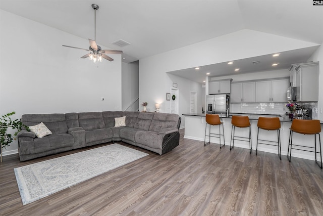 1401 Ardennes Dr, Elgin, SC 29045 - living room featuring wood finished floors, vaulted ceiling, ceiling fan, recessed lighting, and baseboards