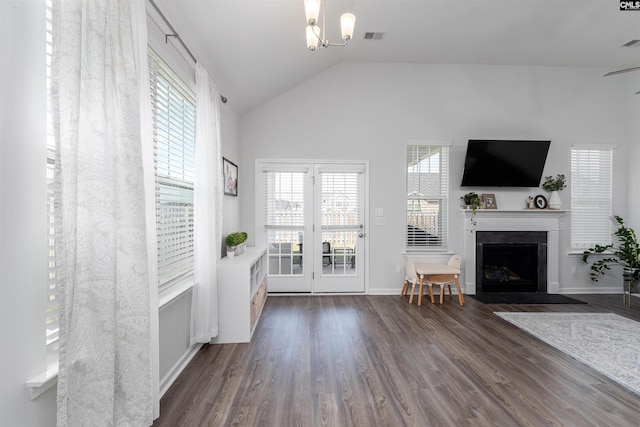 1401 Ardennes Dr, Elgin, SC 29045 - living room featuring dark wood-style floors, a fireplace with flush hearth, a chandelier, vaulted ceiling, and baseboards