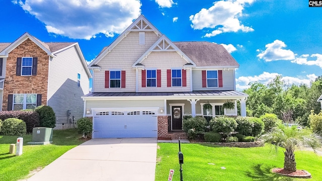 121 Ashford Way, Lexington, SC 29072 - craftsman-style home featuring a standing seam roof, a porch, concrete driveway, a front yard, and an attached garage