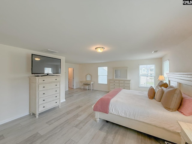 121 Ashford Way, Lexington, SC 29072 - bedroom featuring light wood-type flooring, multiple windows, and baseboards