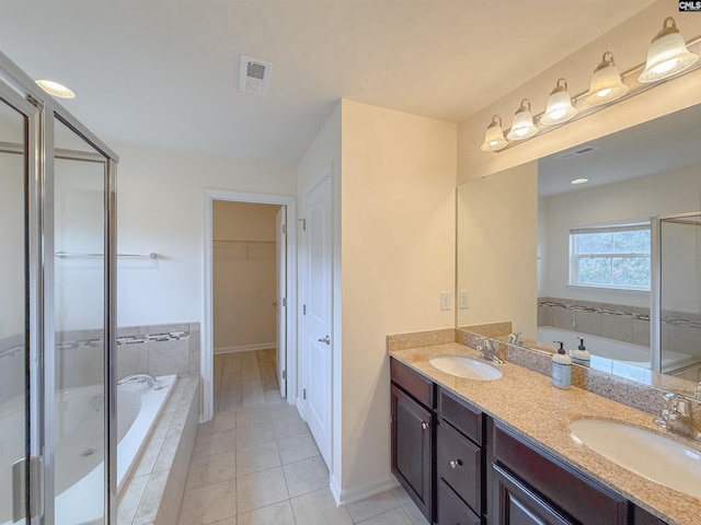 121 Ashford Way, Lexington, SC 29072 - full bathroom with double vanity, a bath, a spacious closet, tile patterned floors, and baseboards